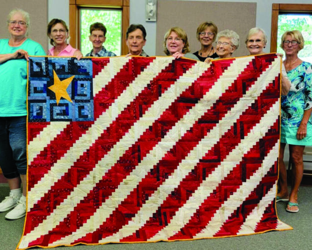 Quilters create special piece for peace officers’ benefit News